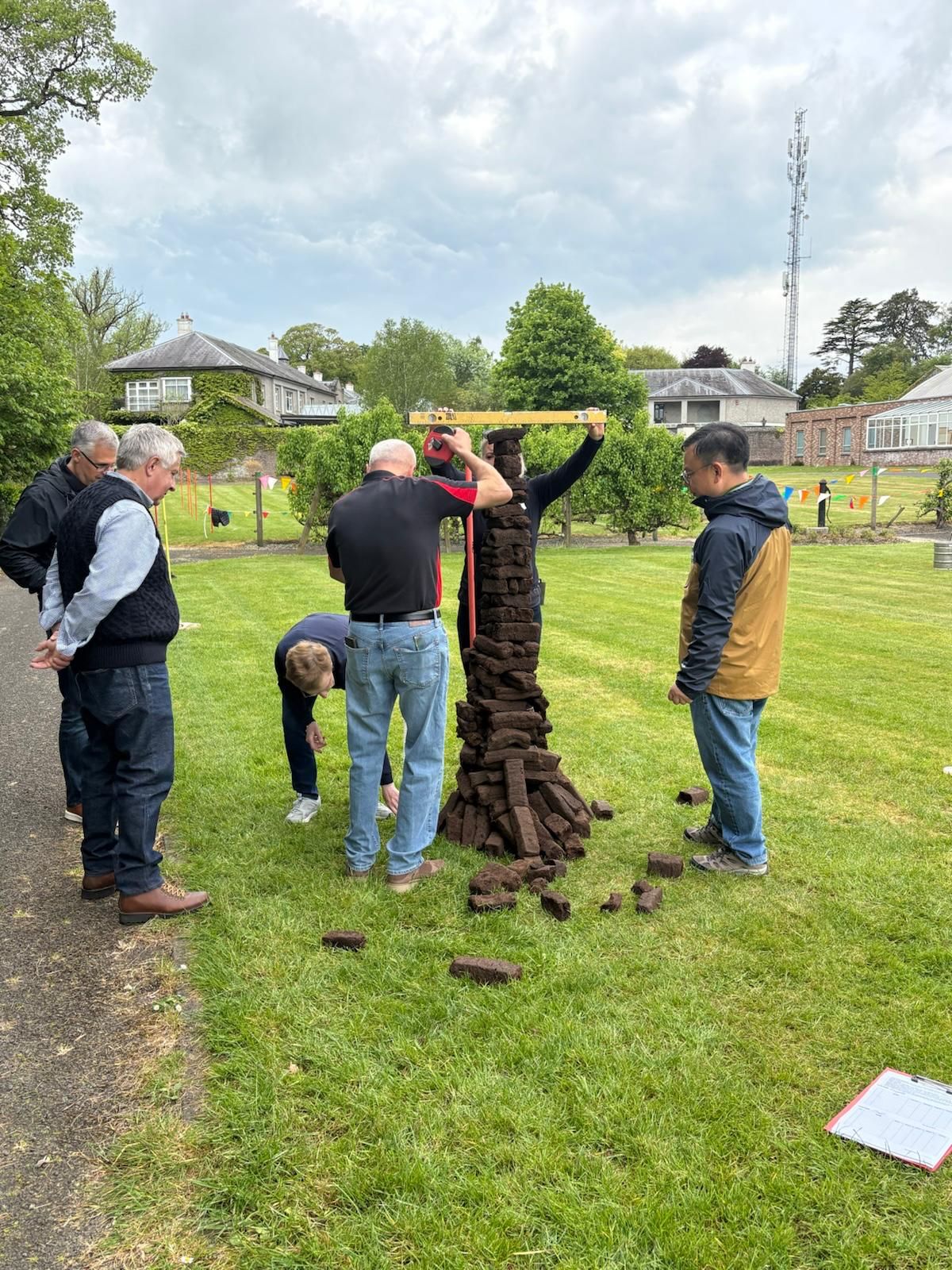 Guests taking part in turf stacking during the Interleges AGM 2026